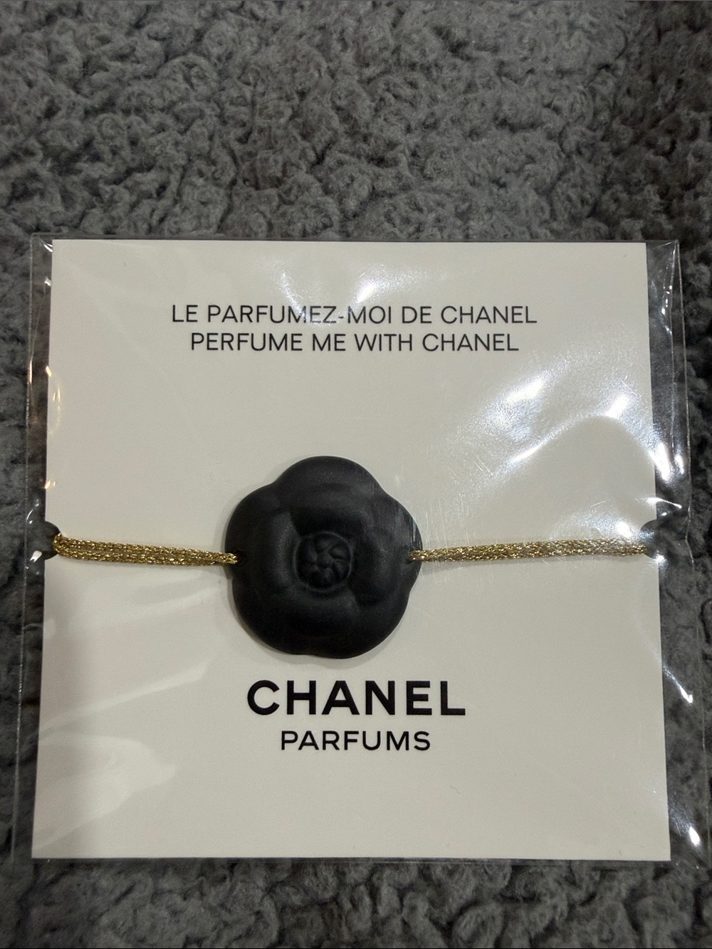 CHANEL Black Camellia Charm Bracelet with Gold Cord